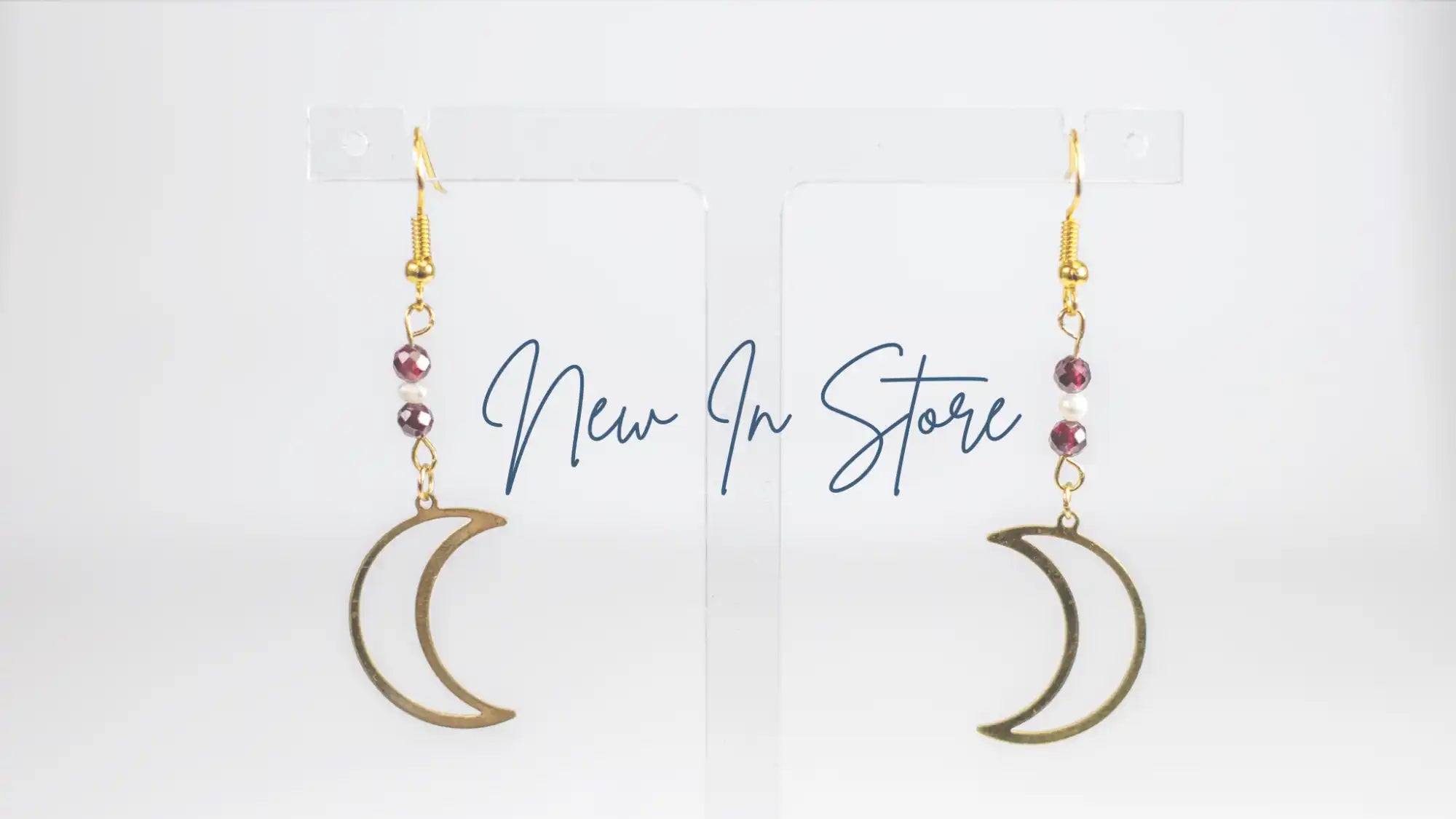 Gold moon earrings.
